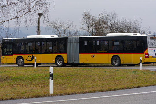 bus, car, europe, yellow, red, black, horn, swiss post bus, roundabout, traffic circle, passing, editorial, close-up, closeup, road, tree, brown, green, meadow, grass, gray, sky, transport, niederglat