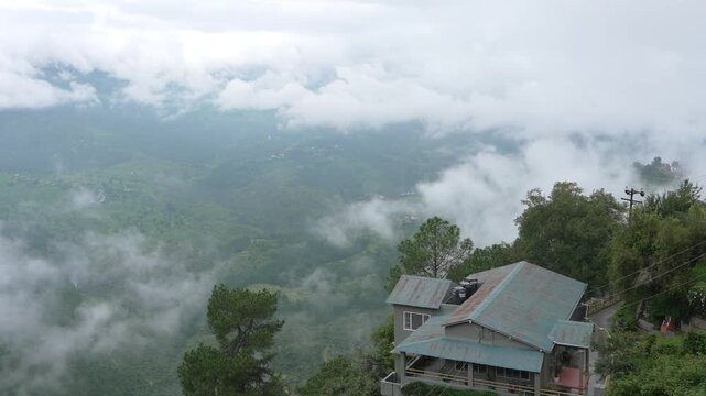 Moody Monsoon Fog Rolling Over Lush Green Himalayan Valley And Hillside House