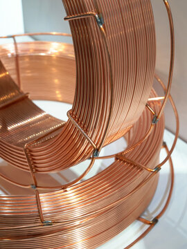 Large spools of copper welding wire. Used for automatic robotic welding in factories and workshops.