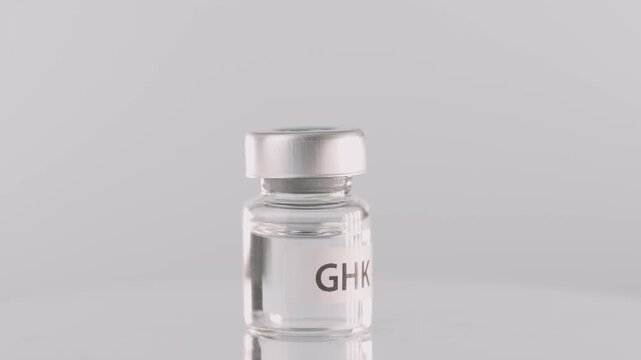 Hopeful scientific research on glass bottle vial containing liquid peptide medicine therapy for promising treatment in clean laboratory wellness