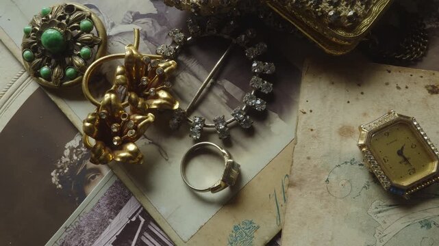 Top-down cinematic slide across antique jewelry and treasured personal belongings, evoking family heritage, remembrance, legacy, and emotional storytelling.