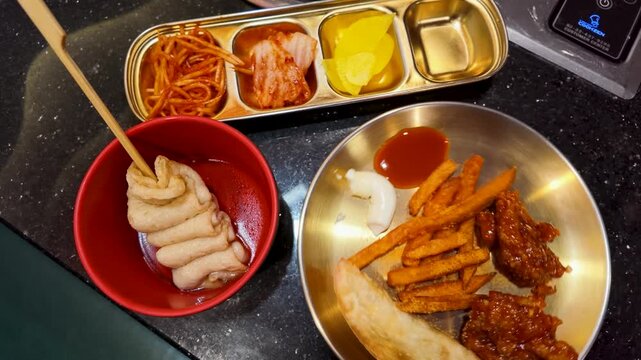 Overhead View of Korean Street Food Platter with Fried Chicken and Odeng