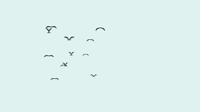 Silhouettes of birds flying across a clear light blue sky