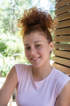 Young woman redhead smiling portrait closeup
