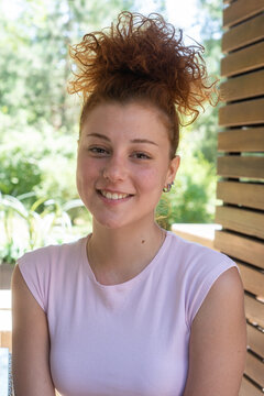 Young woman redhead smiling portrait closeup