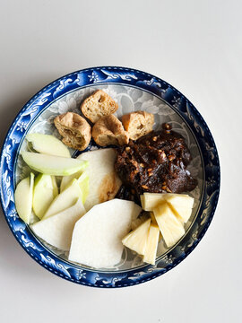 Plate of Asian Rojak with fried tofu and shrimp paste