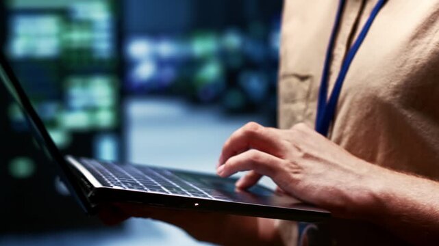 Engineer prepares recovery documentation in a data center, connecting backup procedures, service restoration and continuity planning during server recovery plan.