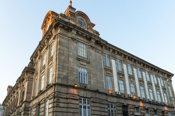 Historic Stone Building Corner with Clock Tower © iBennn