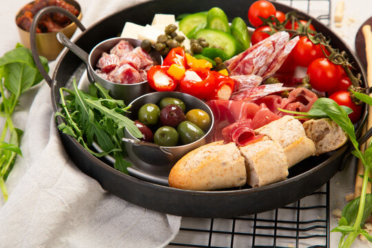 Mediterranean appetizers or antipasto, assorted Italian food.