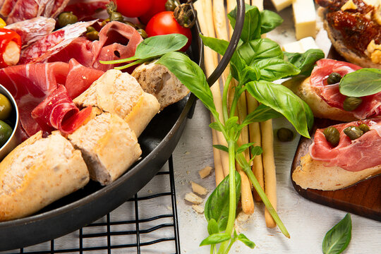 Table full of mediterranean appetizers or antipasto. Assorted Italian food set.