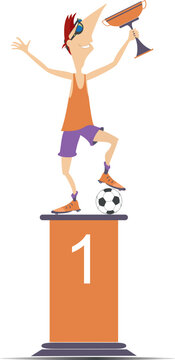 Football player with a winner cup standing on the podium of the winner
