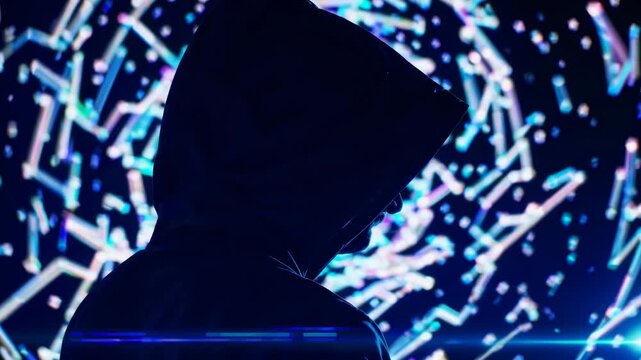 Individual in dark hoodie stands against a swirling, colorful light display, showcasing a dynamic visual experience with vibrant patterns and shapes in the background