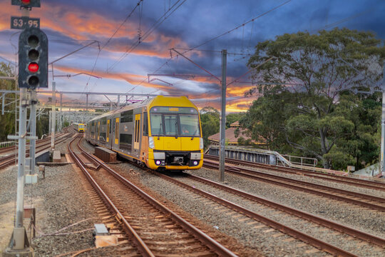 7 July 2026 Passenger Train going through Lewisham Train Station at Sunset a suburban Sydney train Station in Sydney NSW Australia