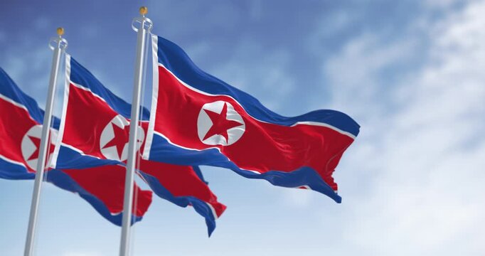 North Korea national flags waving in the wind on a clear day