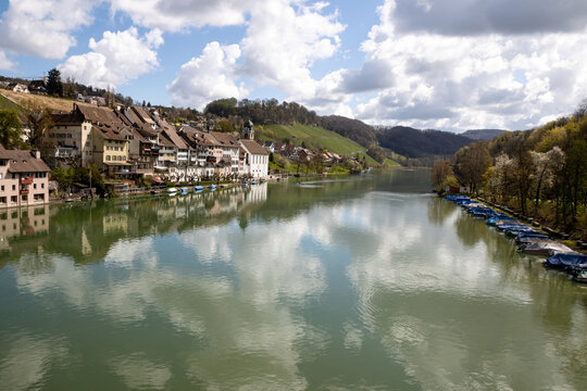 Picturesque riverside village of Eglisau, Switzerland, with historic architecture and boats