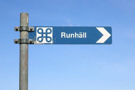 Swedish sign post pointing to a  Runhall an ancient runic inscription site