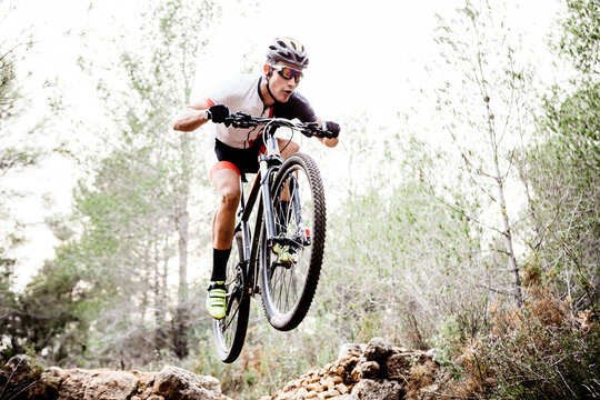 Mountainbiker jumping midair