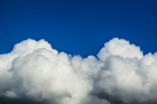 A fast growing cumulus cloud brings bad weather and rain