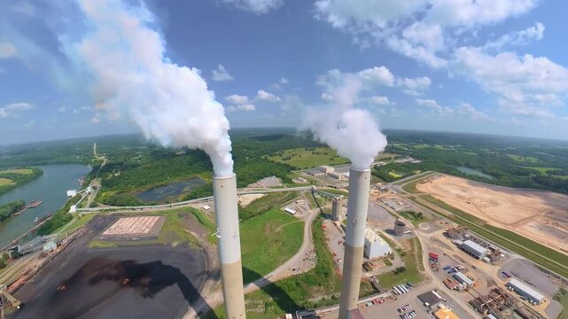 Aerial orbit of a fossil fuel plant located on the Cumberland River in Cumberland City, Tennessee