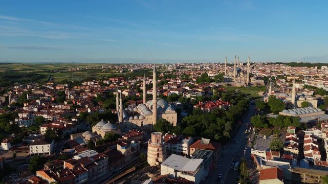 anoramic drone overflight framing historical mosques and minarets rising above the cityscape of Edirne, Turkey. Scenic aerial view capturing traditional Ottoman architectural landmarks