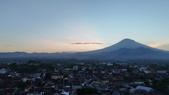 Stunning Aerial View of a Scenic Small Town Surrounded by Volcanoes in Central Java, Indonesia