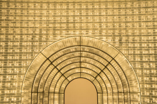 Glass block to decorated to wall and cuve of door that interior of the building.
golden archıtectural arch span patterns and design.
