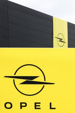 Villefranche, France - February 25, 2024: Opel logo on a wall. Opel is a German automobile manufacturer headquartered in Russelsheim, Germany and a subsidiary of the Groupe PSA since 1st August 2017