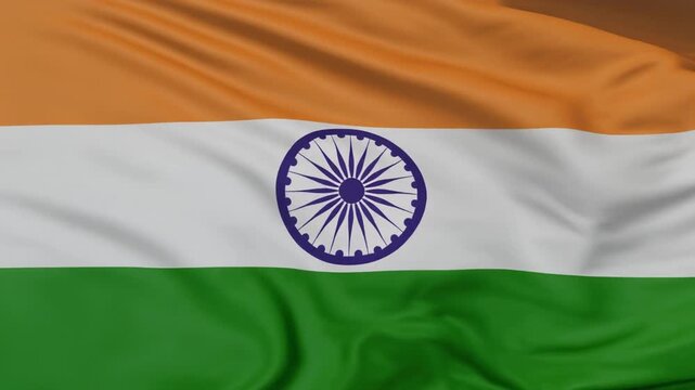 Indian national flag waving with saffron, white, green stripes and Ashoka Chakra, symbolizing unity, peace, and progress in motion.