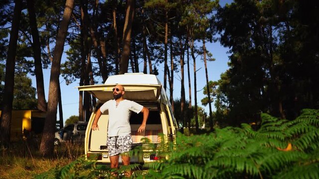 Man Relaxing in Open Vintage Campervan in Pine Forest &ndash; Van Life Lifestyle