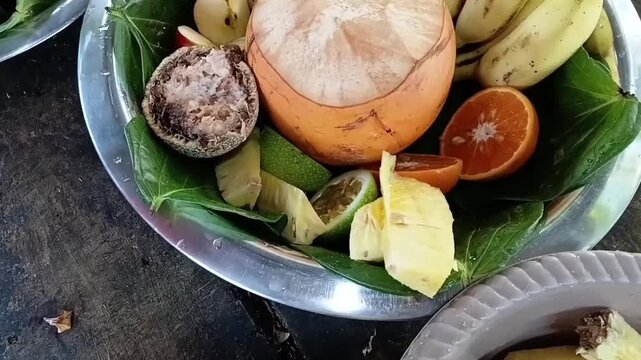 Arranging Fresh Pineapple Slices on a Traditional Silver Tray to Prepare a Holy Palathuru Wattiya Deity Offering in Sri Lanka