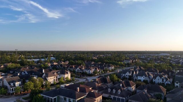 Aerial view of large mansion houses with swimming pool, in affluent neighborhood by Woodlands lake, Houston, Texas, expensive suburban homes surrounding by lush green trees, USA	
