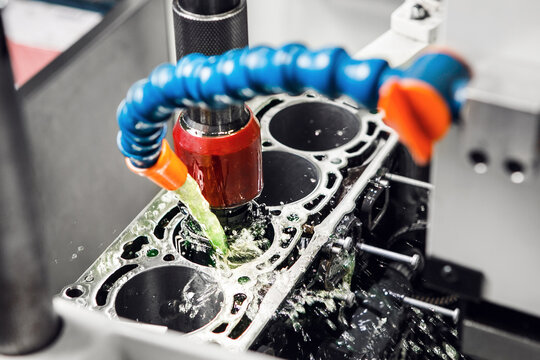 Work of Cylinder honing engine machine. Diamond boring of car details on CNC machine.