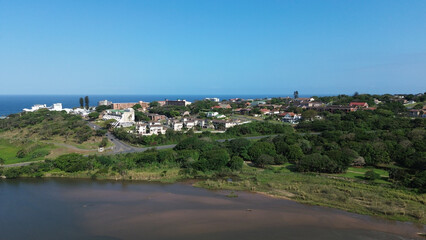 Aerial view of coastal town of Scottburgh residential area and Mkhomazi River or Umkomaas River mouth in the foreground.  Location South Coast of KwaZulu-Natal © Fearless on 4 Wheels