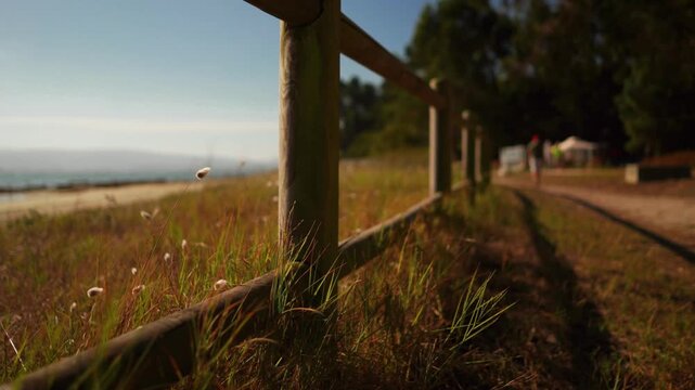 Rustic Wooden Fence Along Coastal Path with Sea View &ndash; Summer Travel Mood