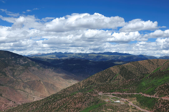 Breathtaking mountain range under a blue sky with scattered clouds