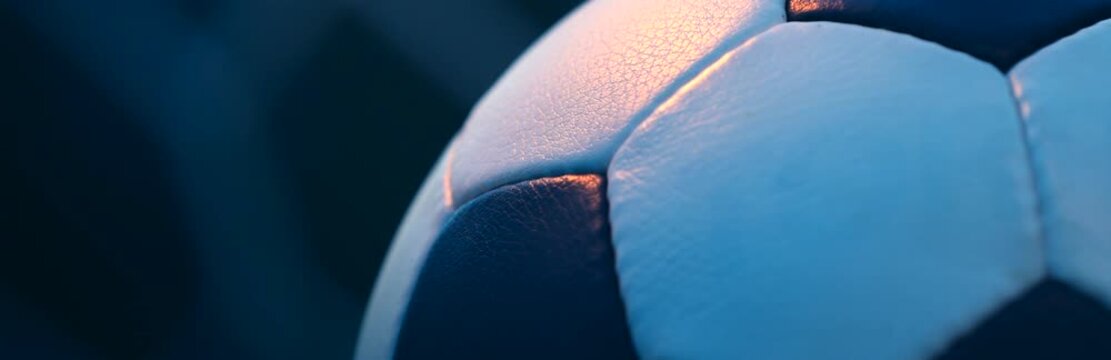 Rotating Classic Soccer Ball with Blurred Goal Net Background
