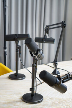 Professional podcast microphones studio equipment recording session broadcast workspace table webinar