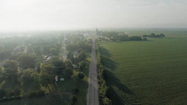 Aerial flyover into rural Iowa town.