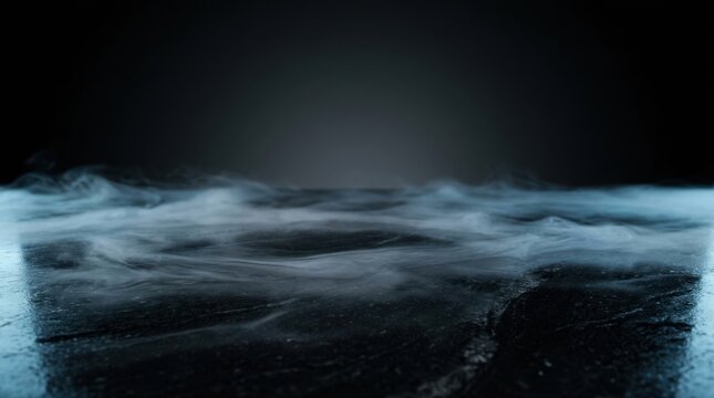 Low angle view of ethereal white mist swirling over a dark reflective textured floor surface