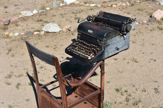 Historic Typewriter and Telegraph Machines Showing Rust and Age
