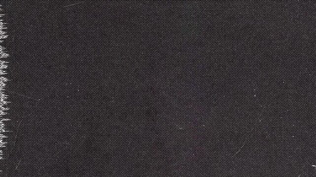 Dark Textured Fabric with Jagged Edge and Horizontal Lines
