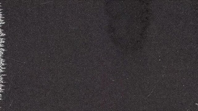 Dark Textured Fabric with White Frayed Edge black textile