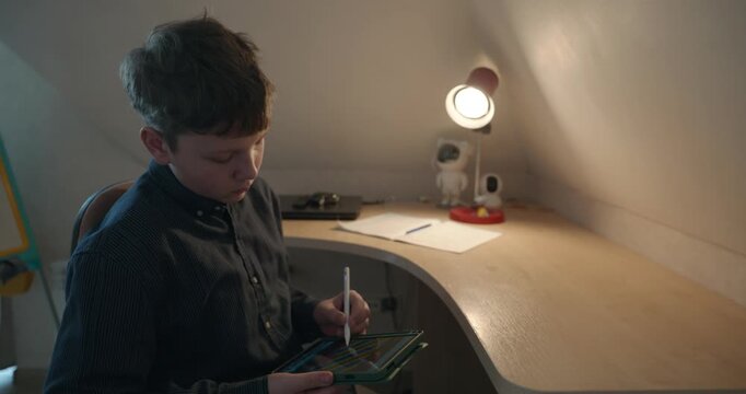 Kid Boy Draw with Stylus Pen on Tablet. 4K 10-bit