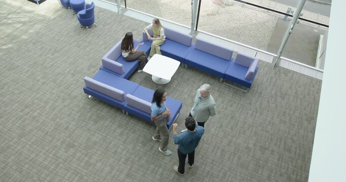 High angle view on Business People Meeting in Office Atrium