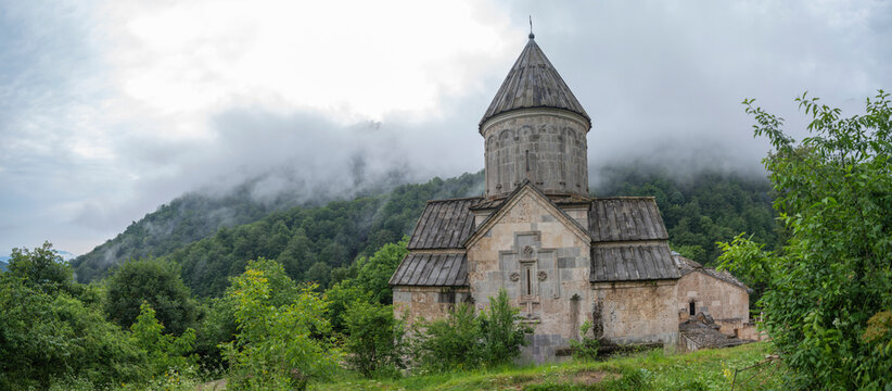 Haghartsin monastery panorama in foggy Dilijan mountains with copy space