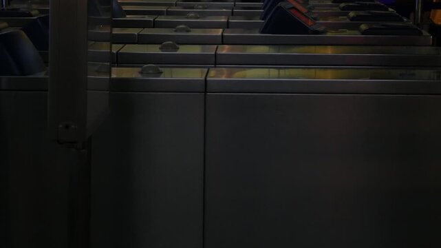 Editorial July 06 2026 &mdash; Commuters Passing Through Automatic Ticket Gate Turnstiles at BTS Skytrain Station, Bangkok Thailand Public Transportation