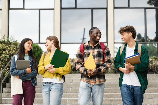 Uni Students Walking University staircase talking and Laughing, after classes and exams