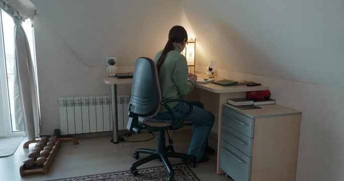 Girl Draw Pictures With Pencil on Desk Table in Bedroom at Home. 4K 10-bit