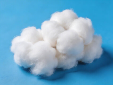 White cotton balls on blue surface