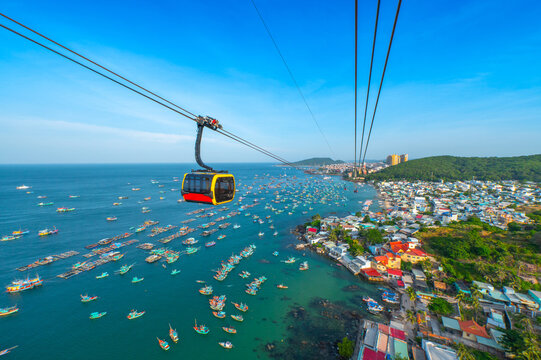 The longest cable car situated on the Phu Quoc Island in South Vietnam and below is traditional fishermen boats lined in the harbor of Duong Dong town in the popular Hon Thom island